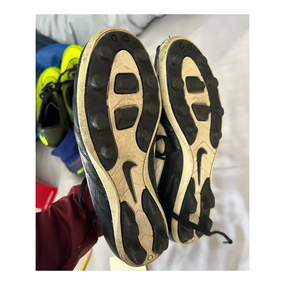 Nike black and white cleats size 2.5